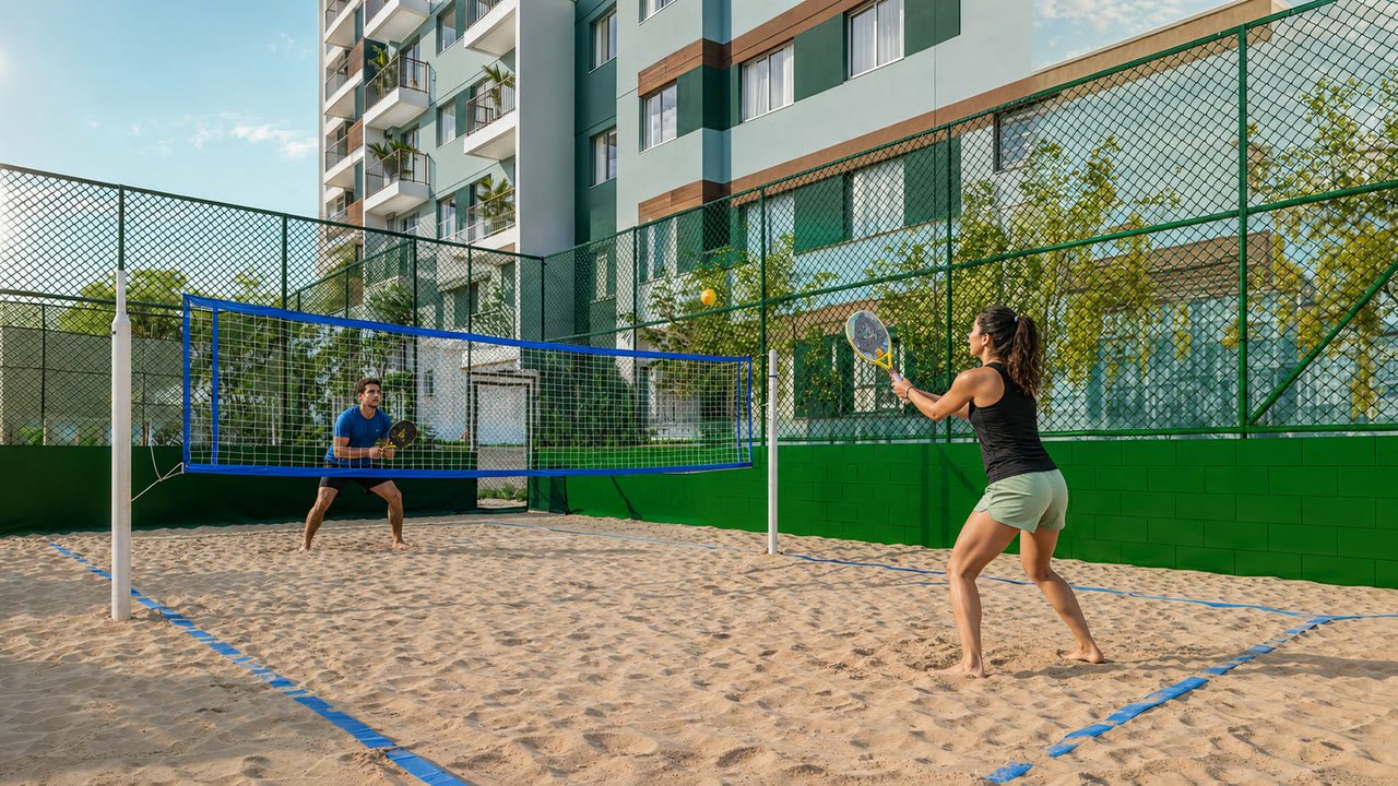 Dois moradores jogando beach tennis na quadra de areia do condominio